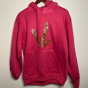 Hoodie Sweatshirt Hot Pink with “ILY” in hand shape.